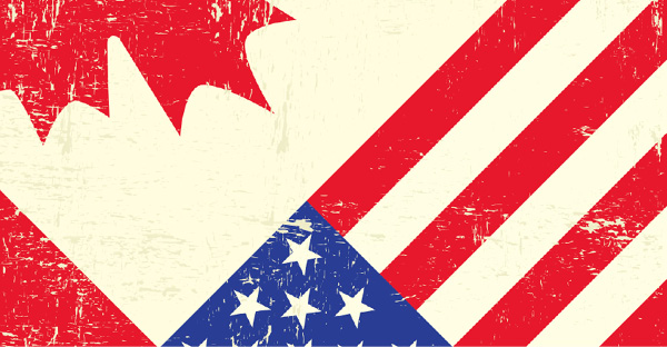 Canada and U.S. flags juxtaposed