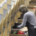 Worker pulling packages off DSW's sortation system