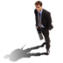 A businessman casts a shadow shaped like a soldier