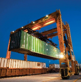 Transferring an intermodal shipping container to rail